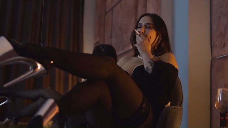 Smoking while wearing high platforms.
