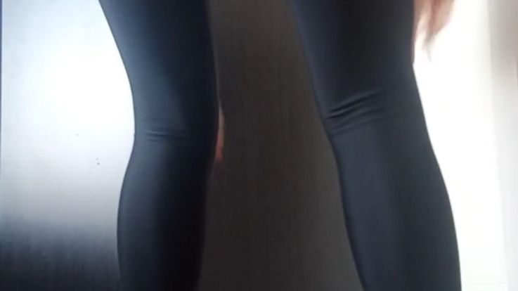 Squatting in black leggins