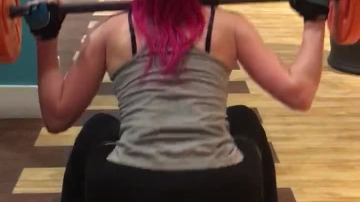 Jenna Luxury squatting 20kg in skin tight pants
