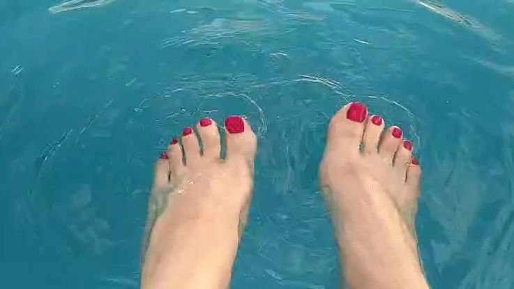 My tiny feet in the pool! Close up!